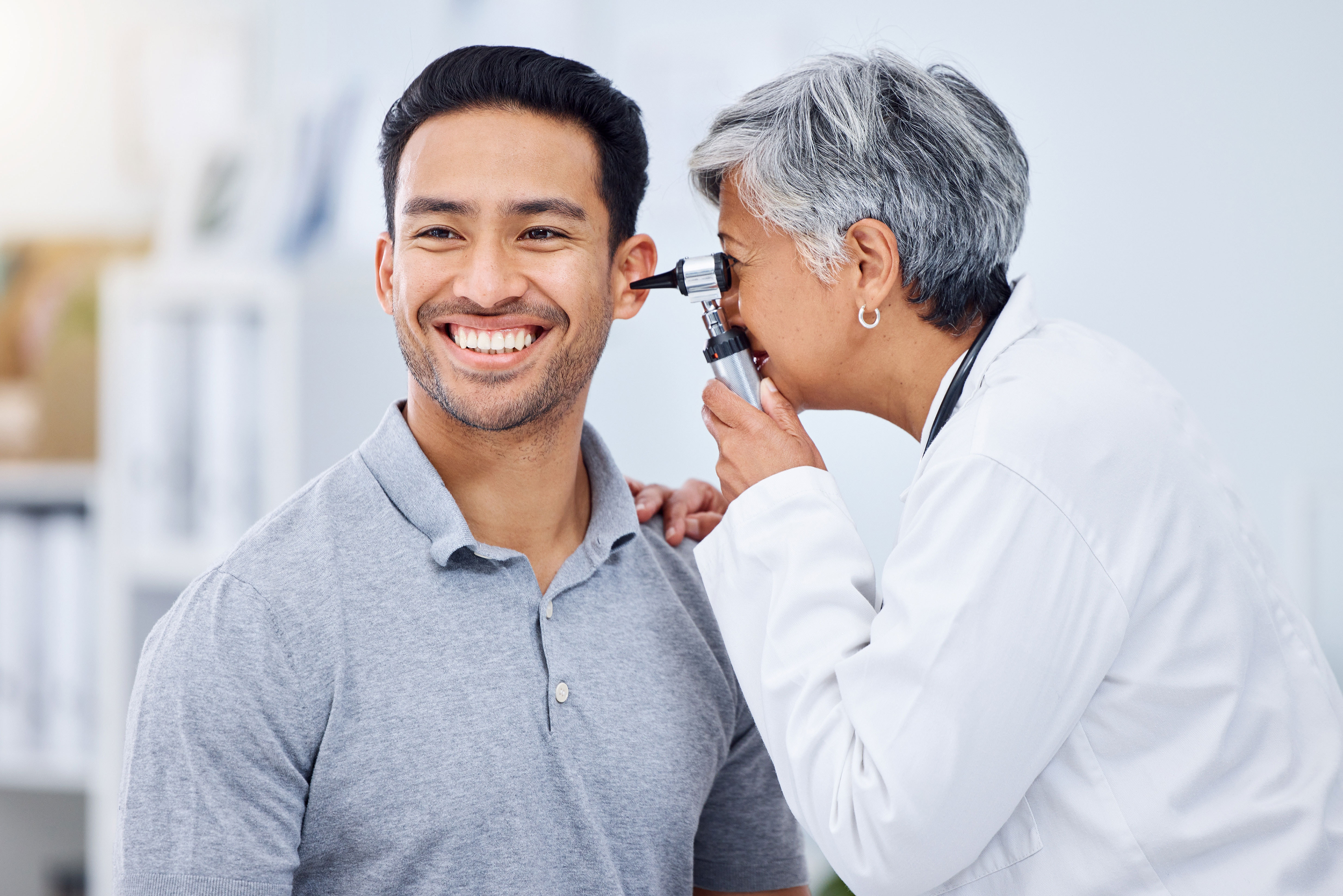 Smiling doctor with a child patient